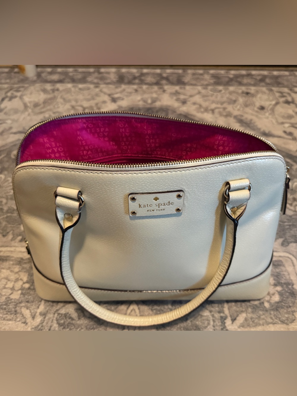 kate spade cream satchel with fuchsia interior